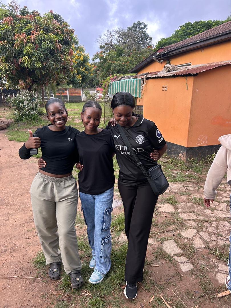 Three Save the World Foundation volunteers together during outreach